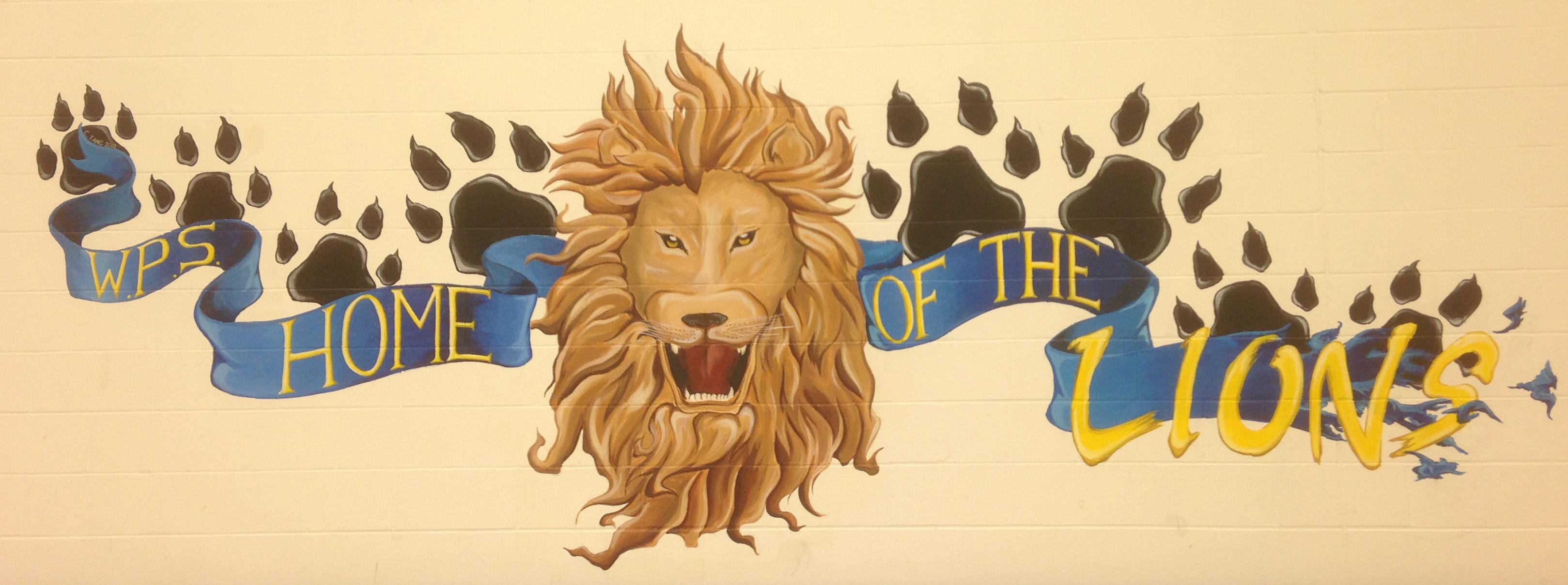 image of a painting on a school wall of a lion head roaring with paw prints behind it. A blue banner reads WPS Home of the lions